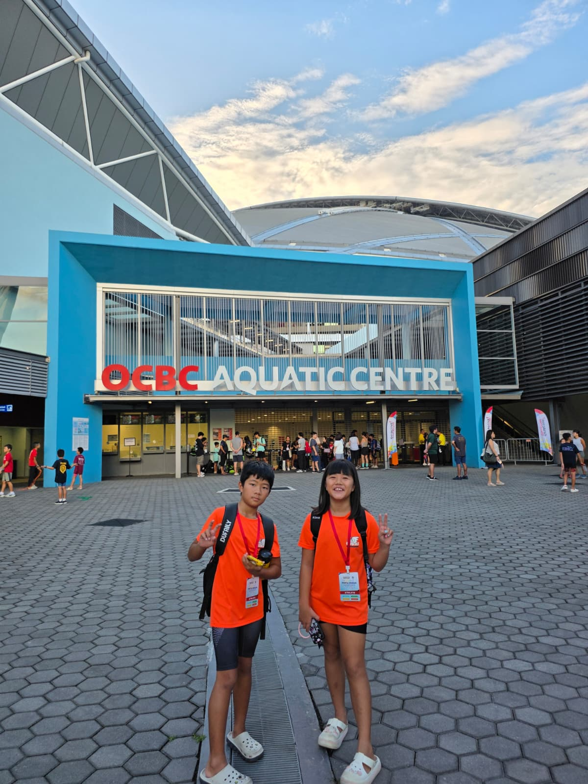 Evan Liew and Sarah Liew outside OCBC Aquatic Centre at Pesta Sukan in June 2026